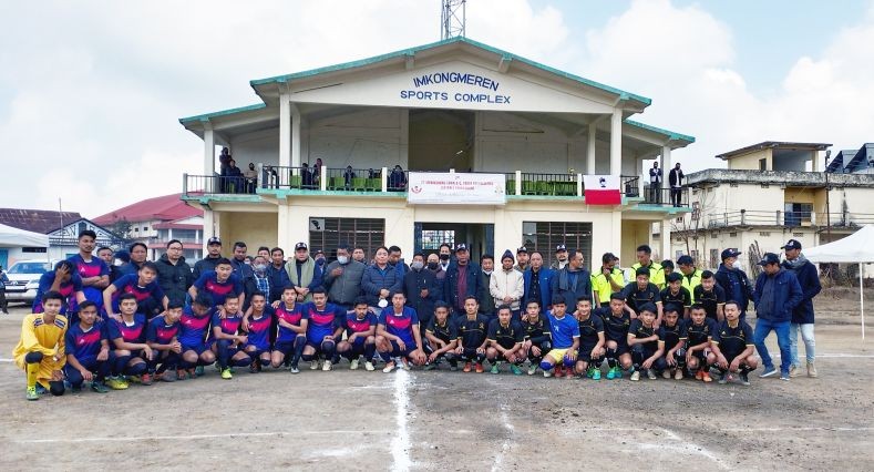 Minister for RD, Metsubo Jamir (centre) along with the officials of 27 Mokokchung Town AC Youth Organisation and players from Mongsenbai and Aongza just before the start of the first match of the three day football tournament at Imkongmeren Sports Complex, Mokokchung on January 31.